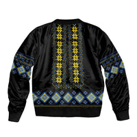 Black bomber jacket with yellow and blue folk stripe embroidery, ribbed hem
