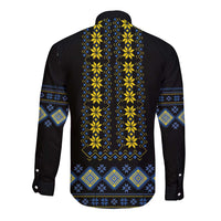 Black long-sleeve button shirt with yellow and blue folk geometric back