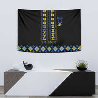 Black tapestry with yellow-and-blue vertical embroidery and blue diamond folk border