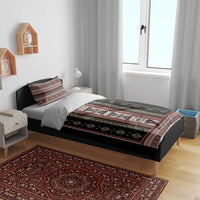 Black folk pattern duvet cover and pillowcases with decorative border and striped center