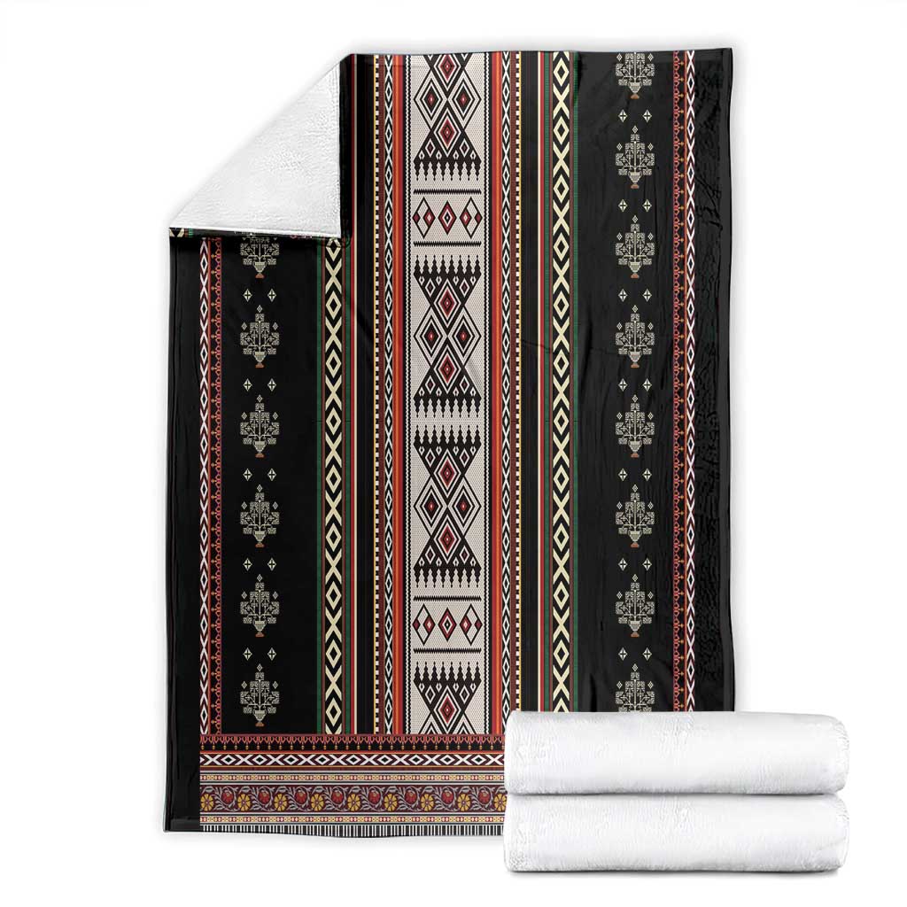 Black folk pattern blanket set with folded white towels on white background