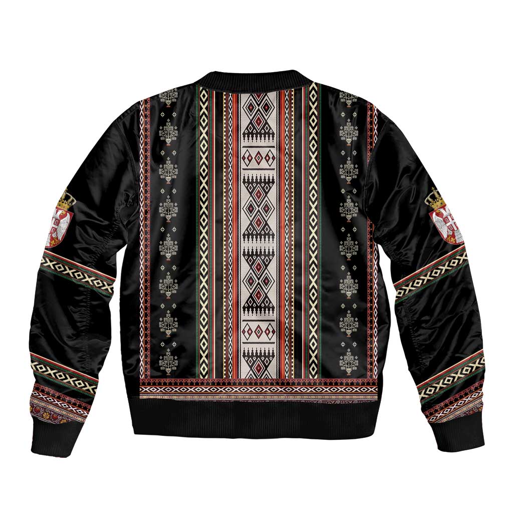 Black bomber jacket back with tall folk stripe vertical panels and ribbed waistband