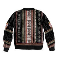 Black bomber jacket back with tall folk stripe vertical panels and ribbed waistband