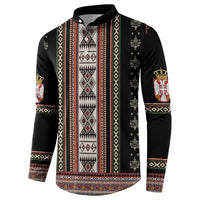 Black crewneck sweatshirt with vertical folk stripes, patterned center panel, and crest logos