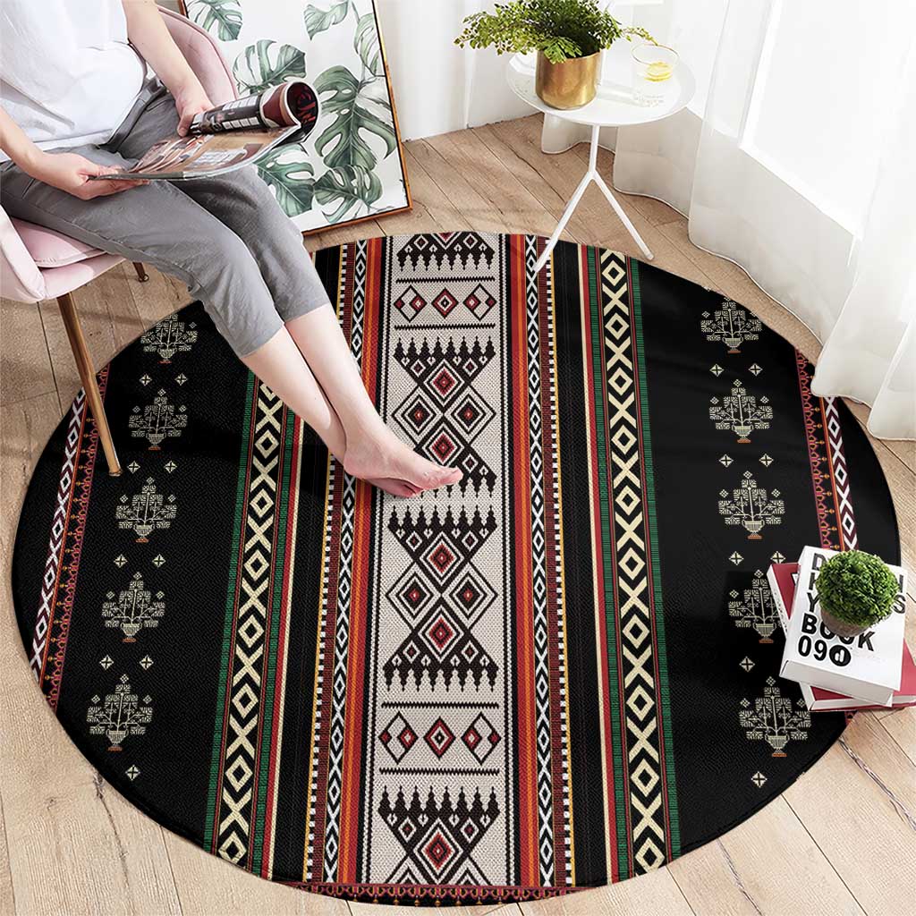 Round black folk-pattern carpet with multicolor vertical stripes and central diamond motif