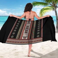 Black folk-pattern sarong with red-and-white vertical panel, tied at back