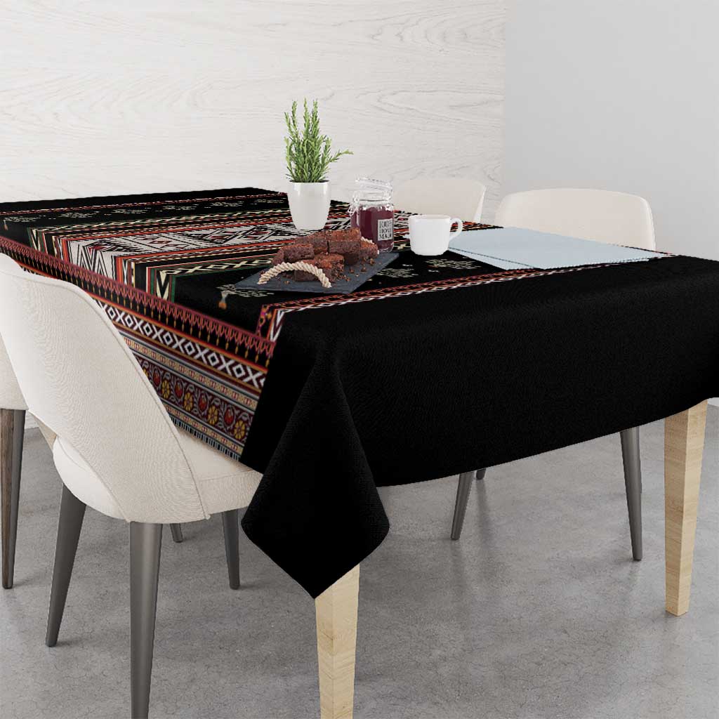 Black tablecloth with multicolor folk bands and corner overhang