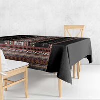 Black folk-pattern tablecloth with striped border and end overhang