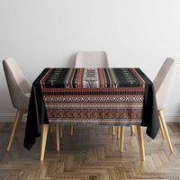 Black folk-pattern tablecloth on dining table with corner drape