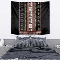 Black folk pattern tapestry featuring wide striped border and central diamond medallion
