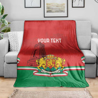 Personalized Bulgaria flag blanket on a gray couch, red-green crest and "YOUR TEXT"