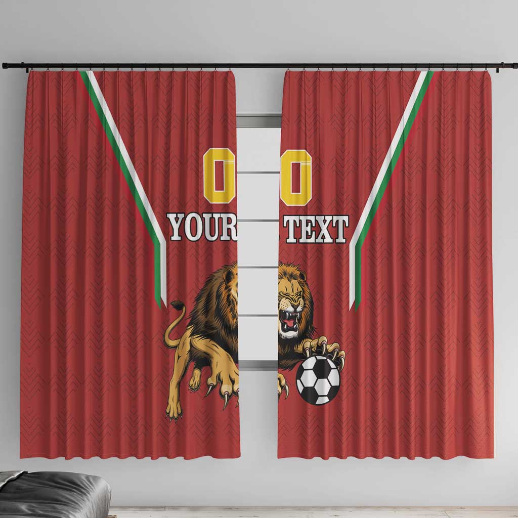 Red curtain panels with lion mascot and soccer ball graphic, centered custom text.