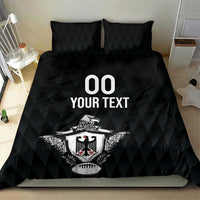 Black bedding set with comforter and two pillows featuring “00 YOUR TEXT” and eagle crest.
