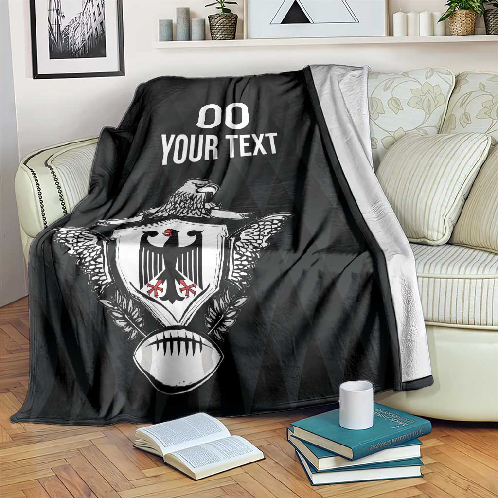 Black rugby blanket with eagle crest and '00 YOUR TEXT' print, sofa drape