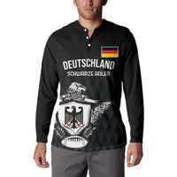 Black rugby button sweatshirt worn by model, Deutschland crest front graphic