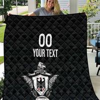 Black quilted rugby throw blanket with diamond stitching and eagle crest graphic