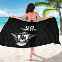 Black geometric-pattern sarong shown wide with '00 YOUR TEXT' and eagle crest