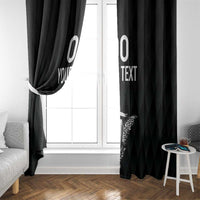 Black curtain pair with eagle crest motif and custom text, draped beside a window.