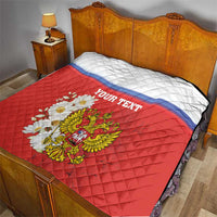 Red quilt blanket with white top, blue stripe, “YOUR TEXT”, and chamomile coat of arms