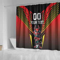 Black shower curtain over white tub, featuring a red devil mascot holding a soccer ball