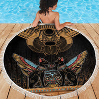 Round black beach blanket with gold scarab beetle wings design and white fringe edge
