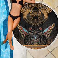 Round black beach blanket with gold scarab beetle artwork and white fringe, poolside