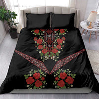 Black bedding set with red rose embroidery, central diamond motif, and geometric V border