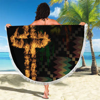 Round black beach blanket with white fringe, flame graphic and checkered pattern