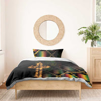Black duvet with flame cross and colorful geometric design, with one matching pillow