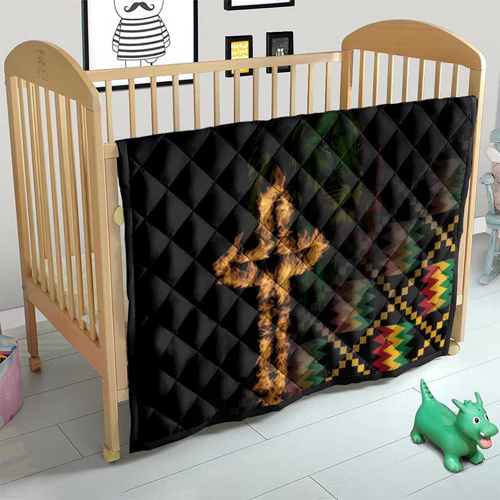 Black quilt blanket on crib, diamond quilting, flaming cross and colorful checker border