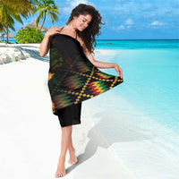 Black sarong wrap with colorful geometric print and lion-and-fire graphic near center