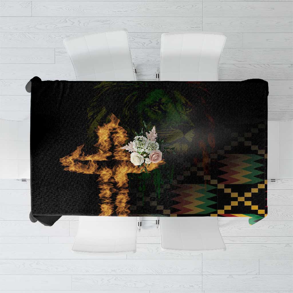 Black tablecloth with colorful cross-and-lion style pattern and flame graphic