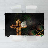 Black tablecloth with colorful cross-and-lion style pattern and flame graphic