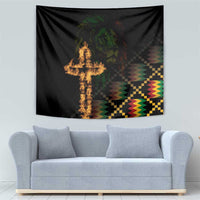 Black tapestry with flaming cross center, lion face above, and colorful geometric zigzag pattern