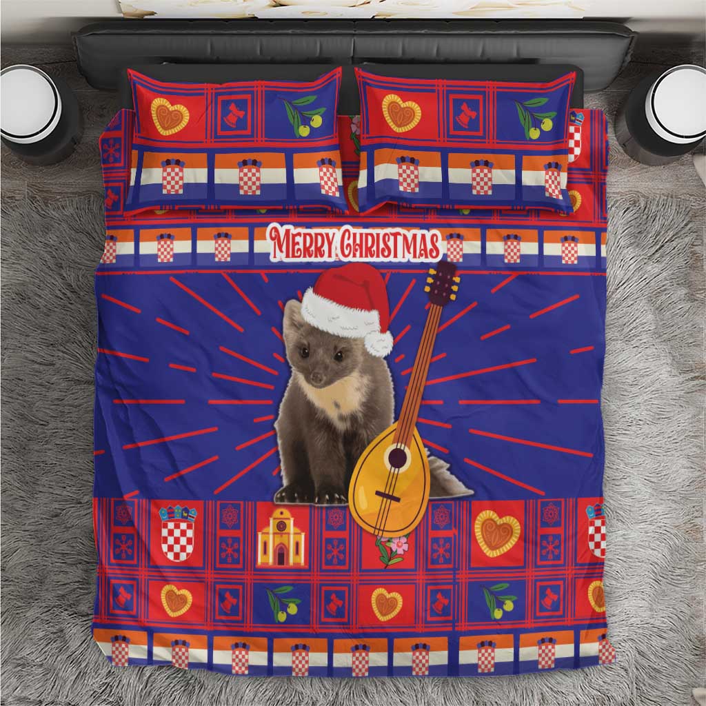 Christmas bedding set with blue and red patterned duvet and two pillowcases, cat in santa hat and guitar
