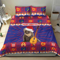 Christmas bedding set with blue and red duvet and two pillowcases, cat in santa hat holding guitar graphic