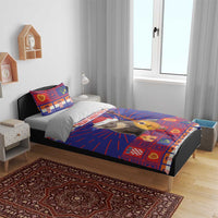 Christmas bedding set with blue and red patterned duvet and two pillowcases featuring cat in santa hat and guitar