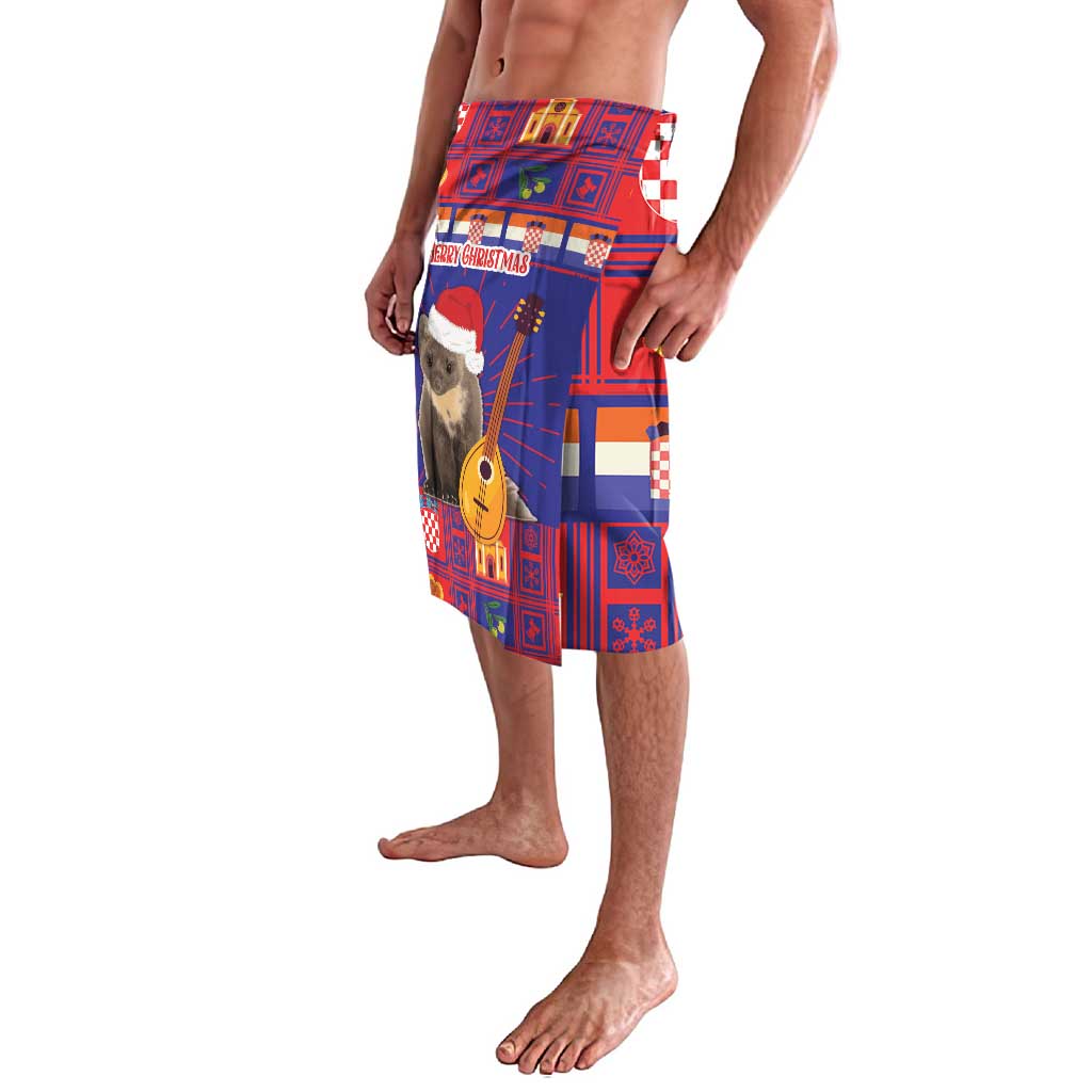 Blue and red Christmas lavalava skirt with guitar and toy soldier print, side view