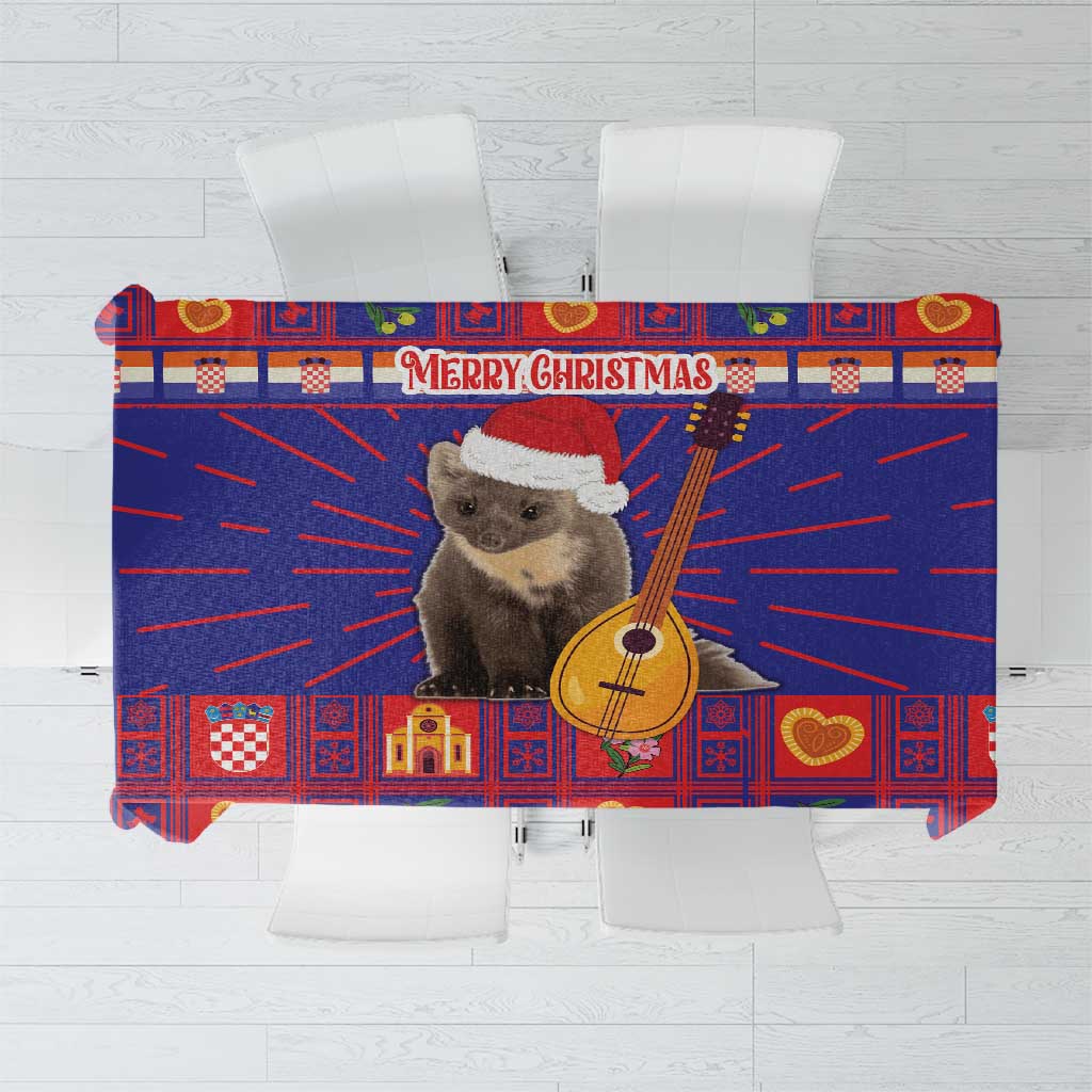 Christmas tablecloth close-up: “Merry Christmas” banner with bear and guitar