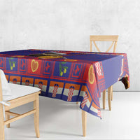 Christmas tablecloth draped over table with blue red heart-and-check square pattern