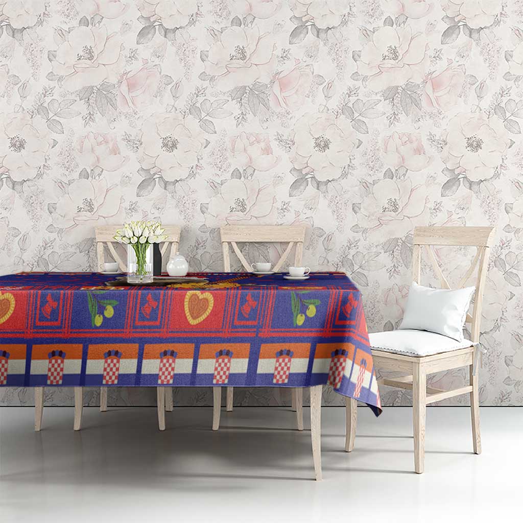 Christmas tablecloth with blue, red, and white check and heart block design