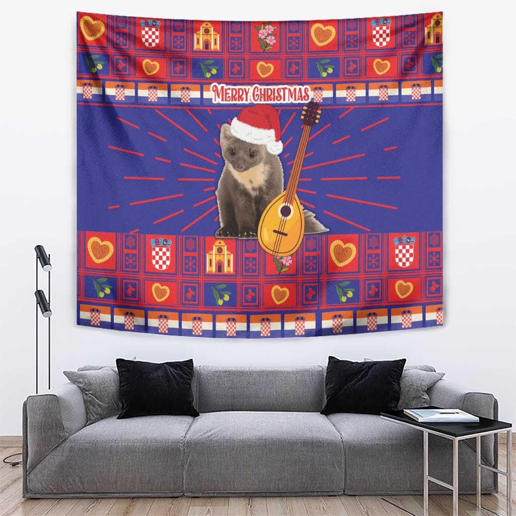 Christmas tapestry with blue backdrop, bear in red Santa hat holding guitar, red patterned border