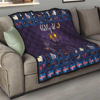 Purple quilt blanket on sofa with blue Christmas cat border and moon graphic