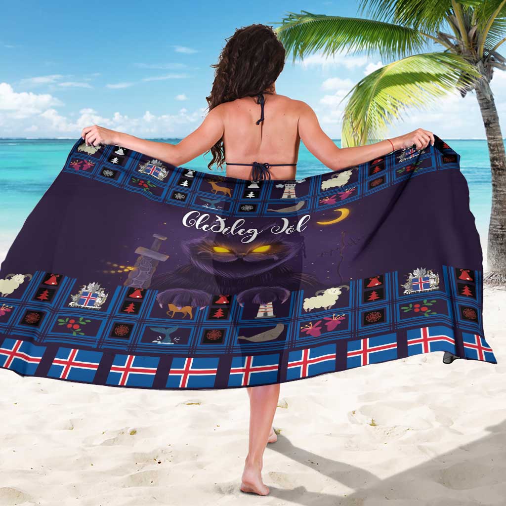 Purple sarong viewed from back, featuring blue grid blocks and glowing cat graphic