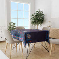 Purple and blue Christmas tablecloth with cat, plaid pattern, and corner drape