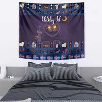 Purple holiday tapestry featuring a glowing cat face, Moon text, and decorated icon grid.