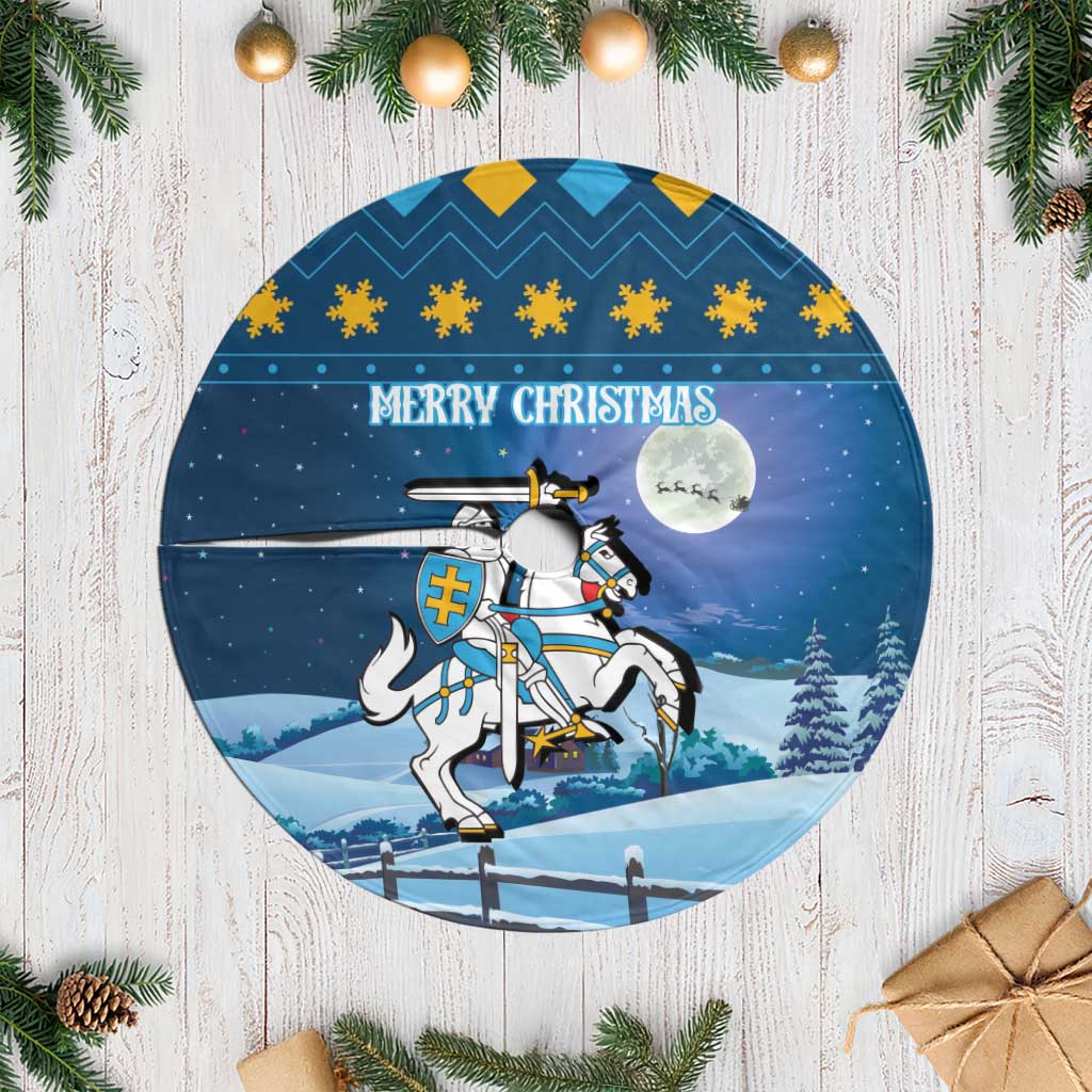 Blue round Christmas tree skirt with Merry Christmas text, knight crest and fringe edge