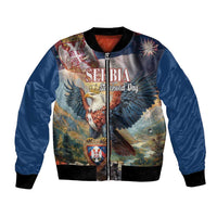 Blue unisex bomber jacket with front zipper, bold eagle graphic and fireworks patch