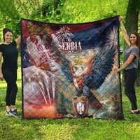Serbia eagle quilt laid flat outdoors, quilted diamond pattern, crest and red-blue-white graphics.