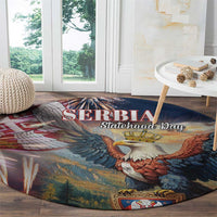 Round blue area rug with eagle over landscape and 'SERBIA Statehood Day' text